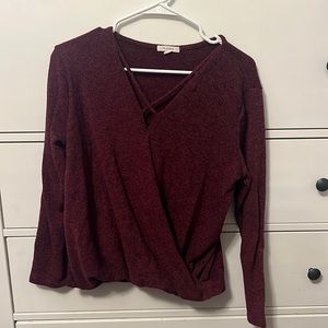 Burgundy v-neck sweater with criss cross neck line detail